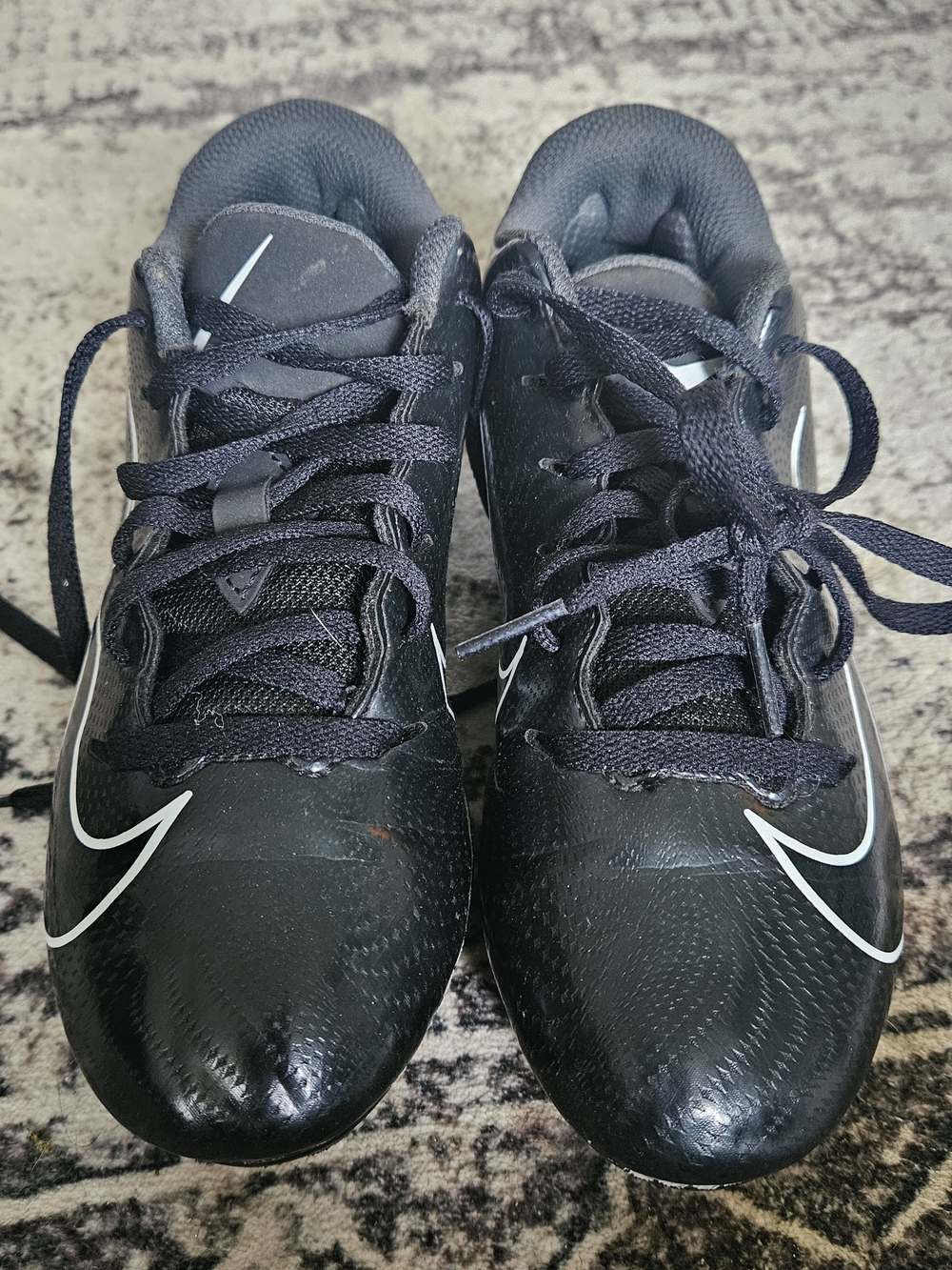 Nike Black Athletic Cleats with White Swoosh